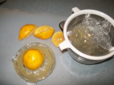 hand juicing the lemons